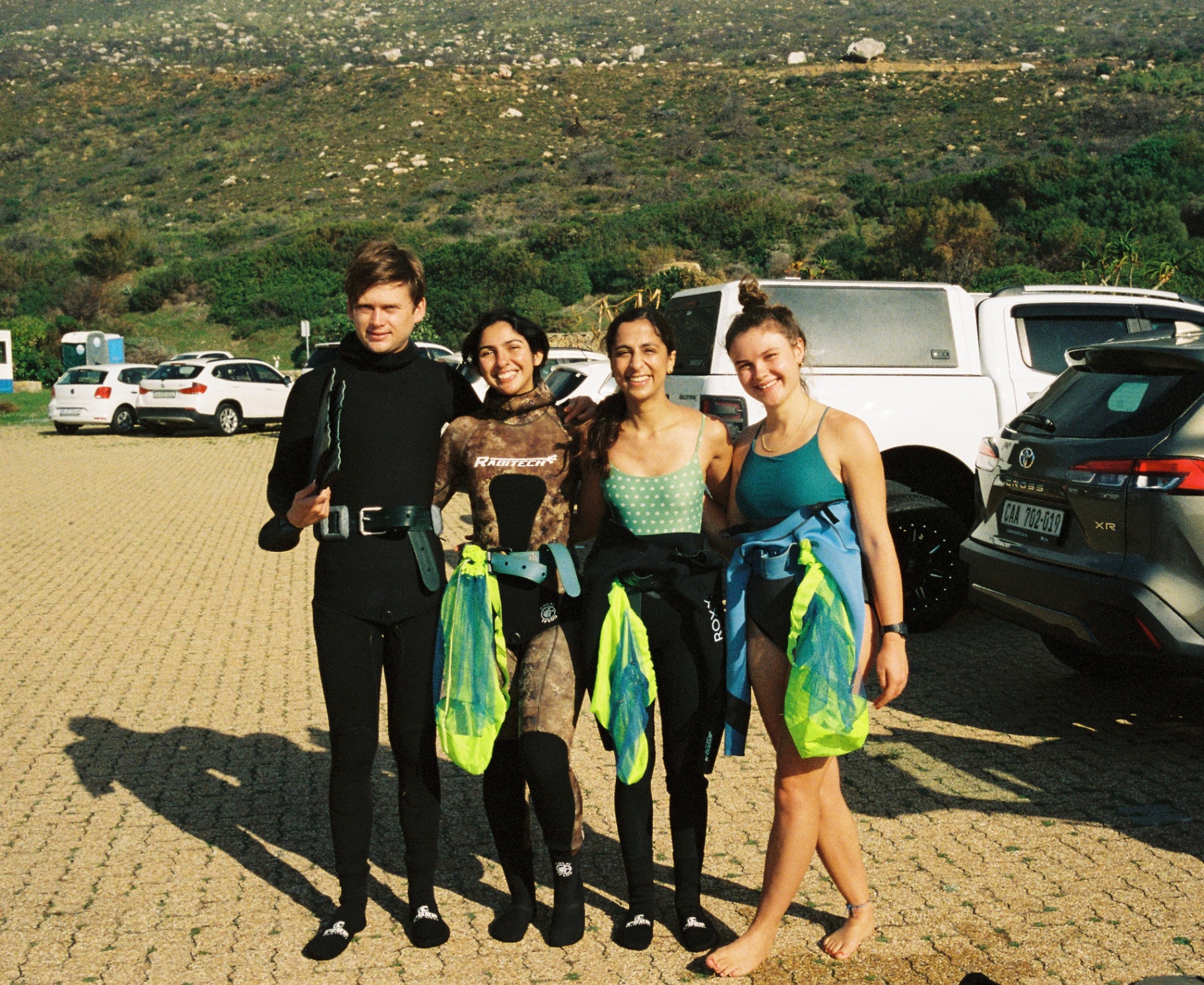 Freedivers back at the car park with weight belts and catch bags