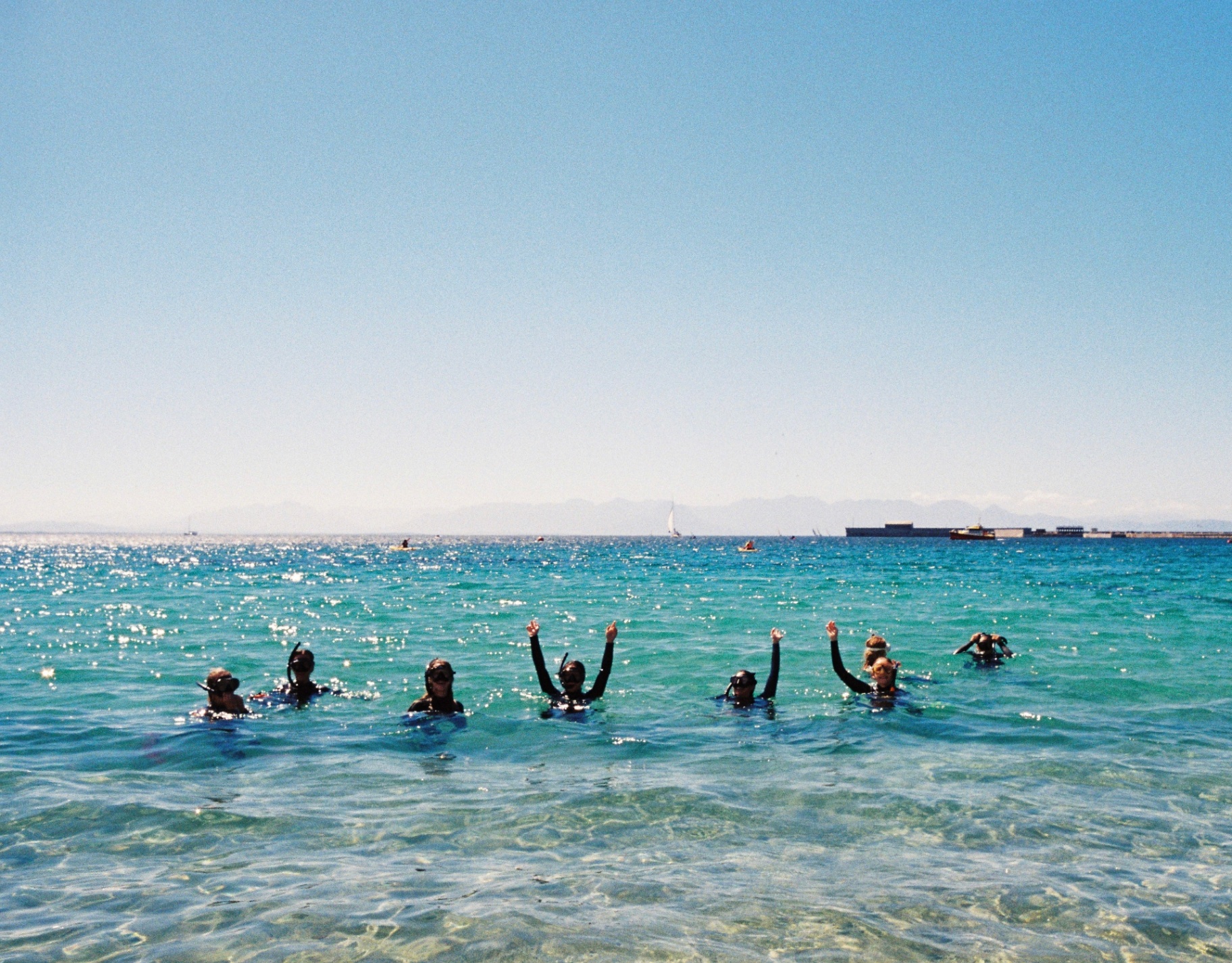 Swim for Trash crew cheering in the water